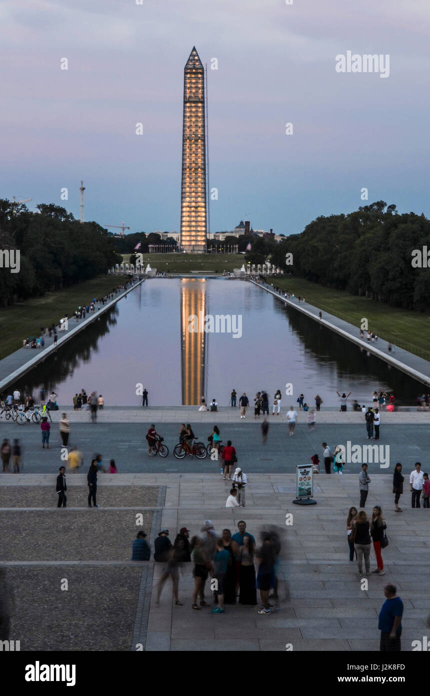 Washington DC, USA - August 15, 2013: Washington Monument and people by Lincoln Memorial and reflecting pool on national mall with construction during Stock Photo