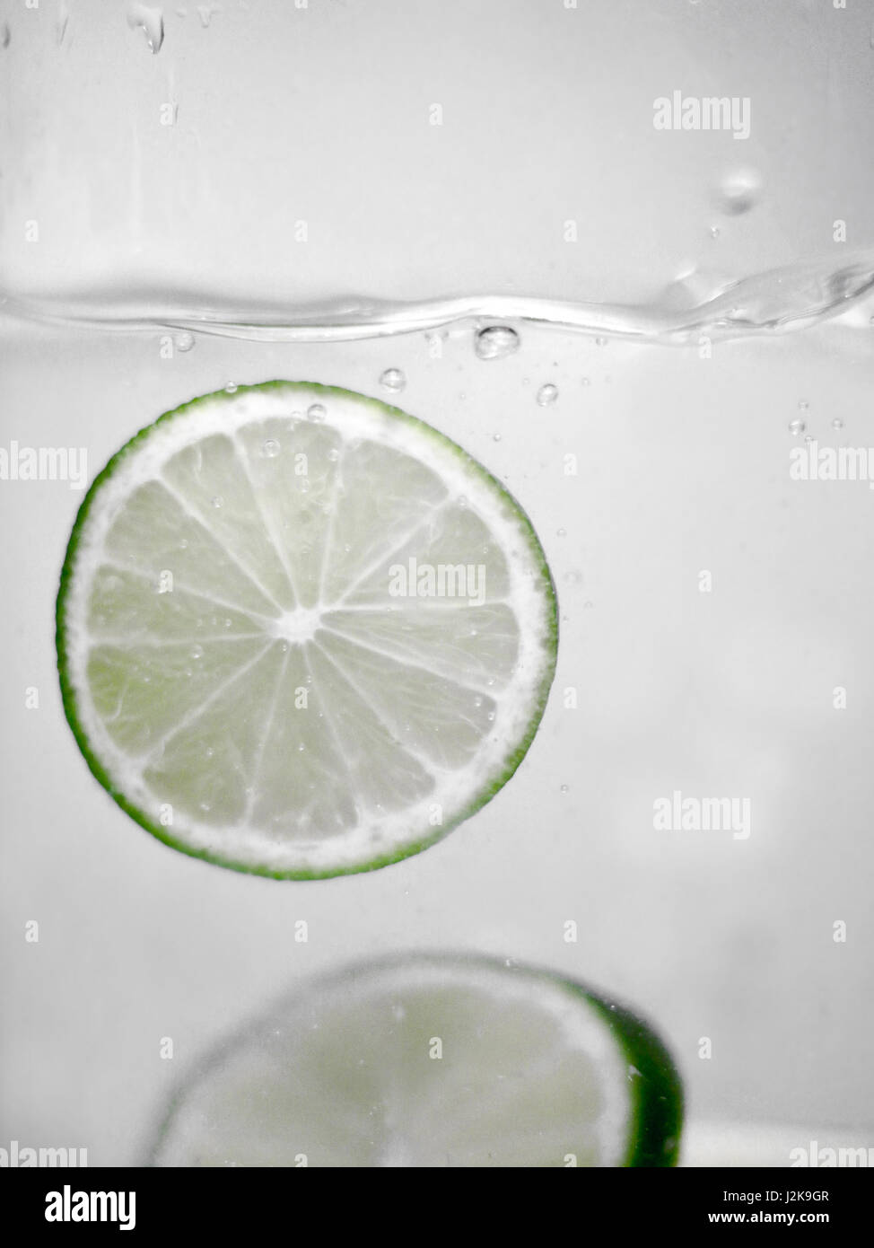 Hey fresh and cool fruits jumping in cold water. Water drops and motion ...