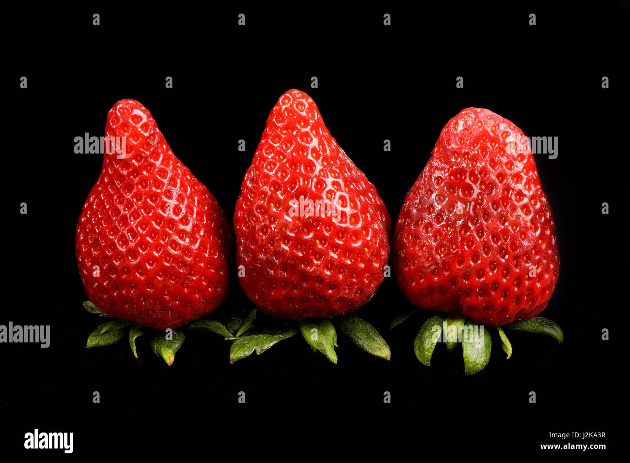 strawberries on black background Stock Photo - Alamy