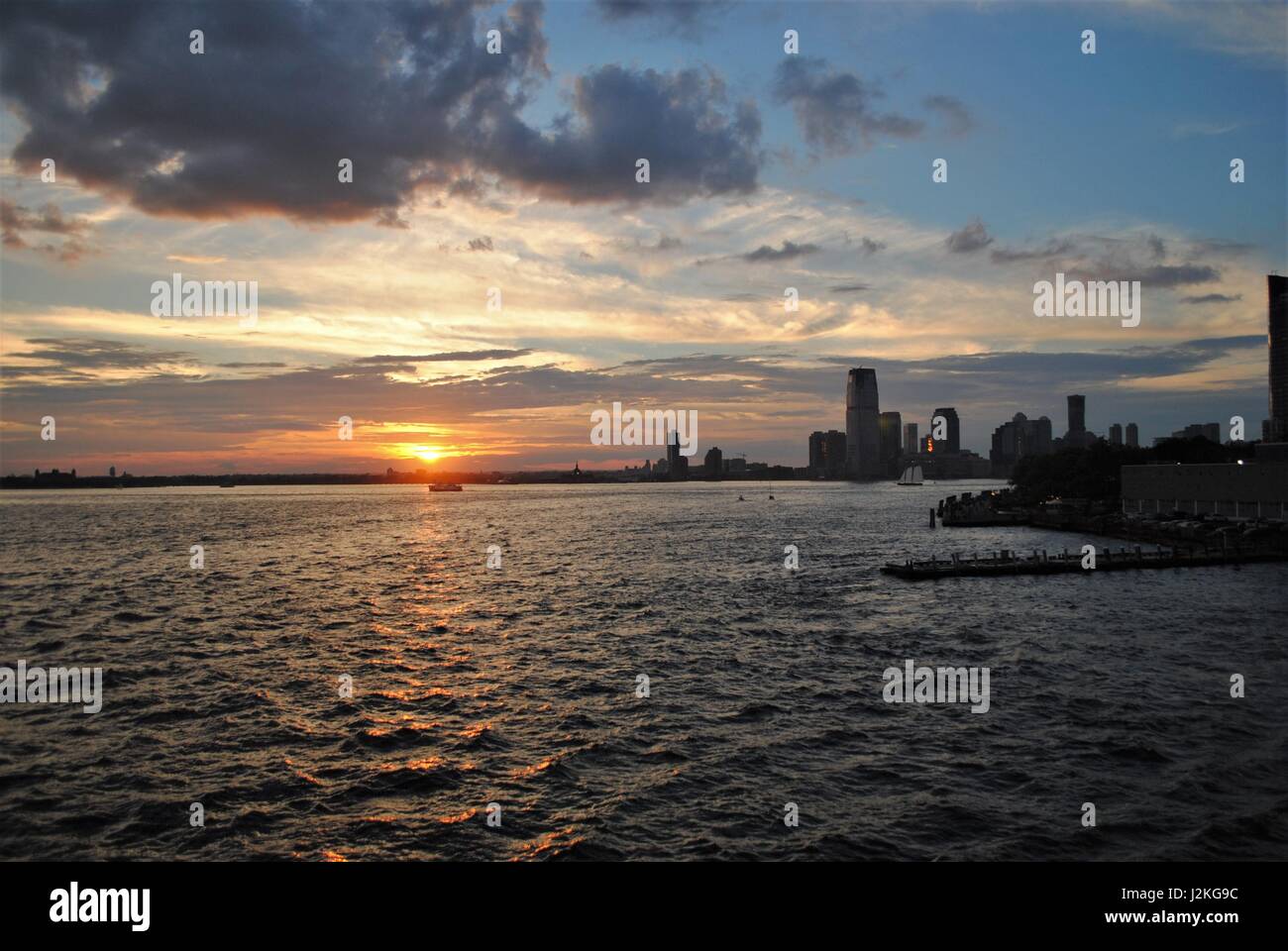Dramatic sunset under the Upper Bay in New York city, the United States Stock Photo