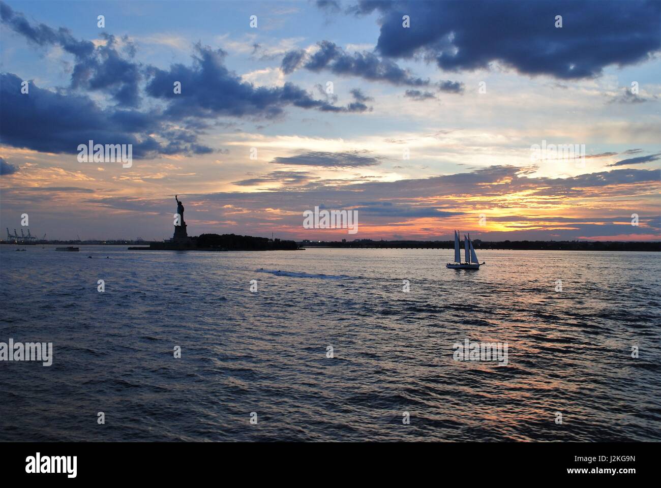 Statue of Liberty with a dramatic sunset behind, New York best travel destination, the United States Stock Photo