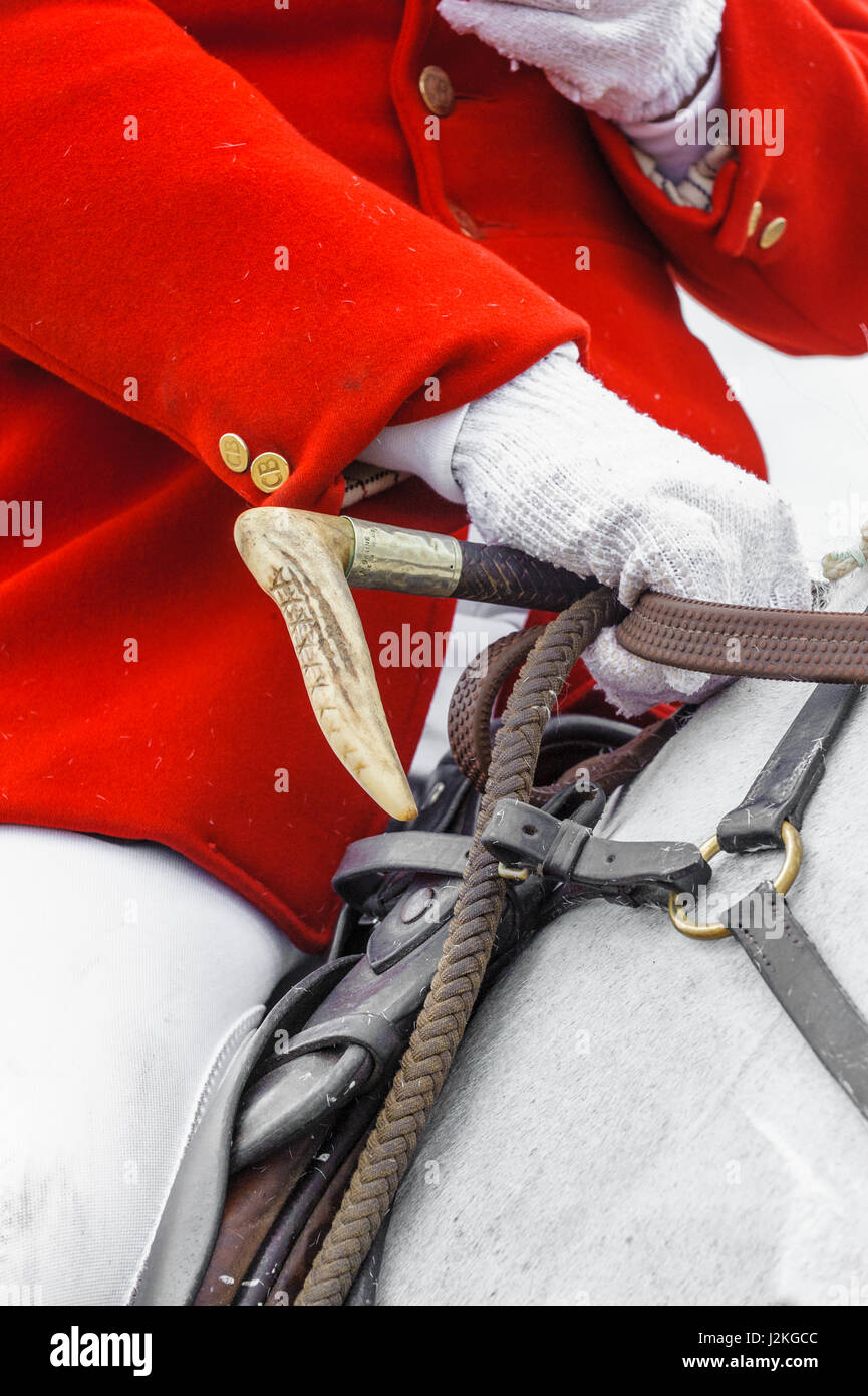 The huntsman of The Cranwell Bloodhounds holding the reins of his horse