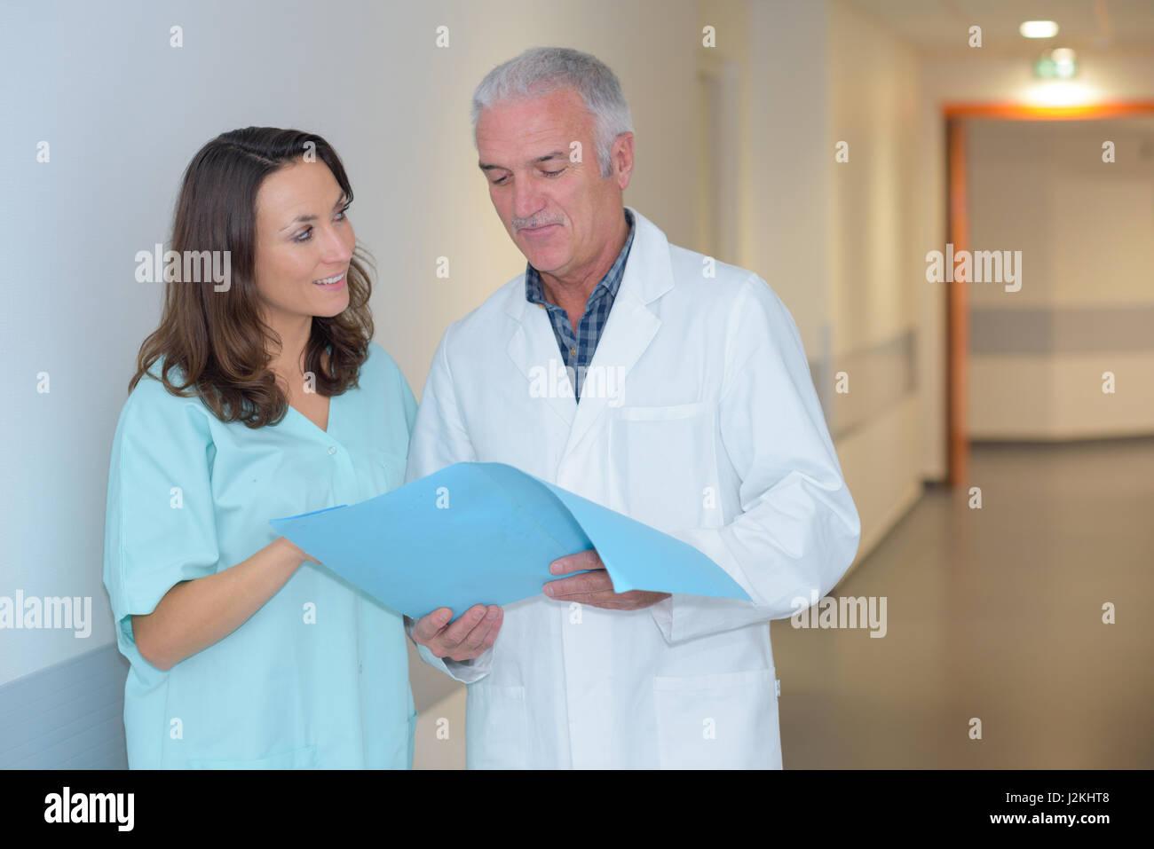 nurse and doctor in hospital corridor Stock Photo