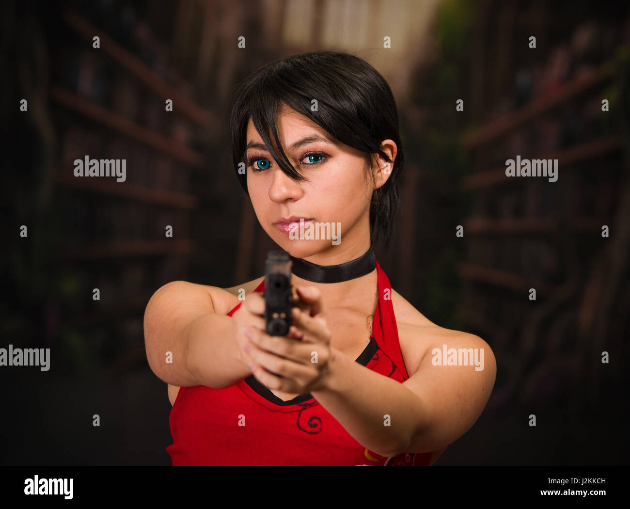 Dangerous powerful Woman Holding a Gun, resident evil cosplay costume Stock Photo