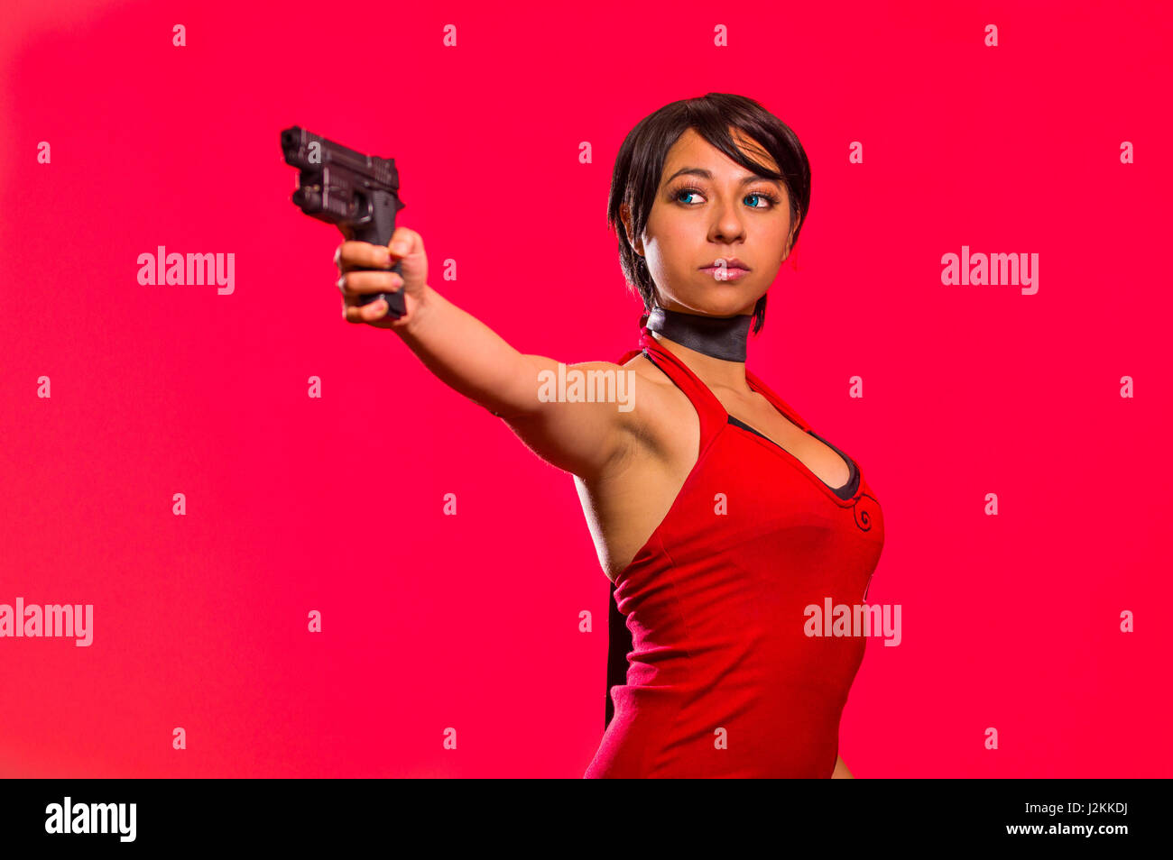 Powerful Woman Holding a gun, resident evil cosplay costume Stock Photo