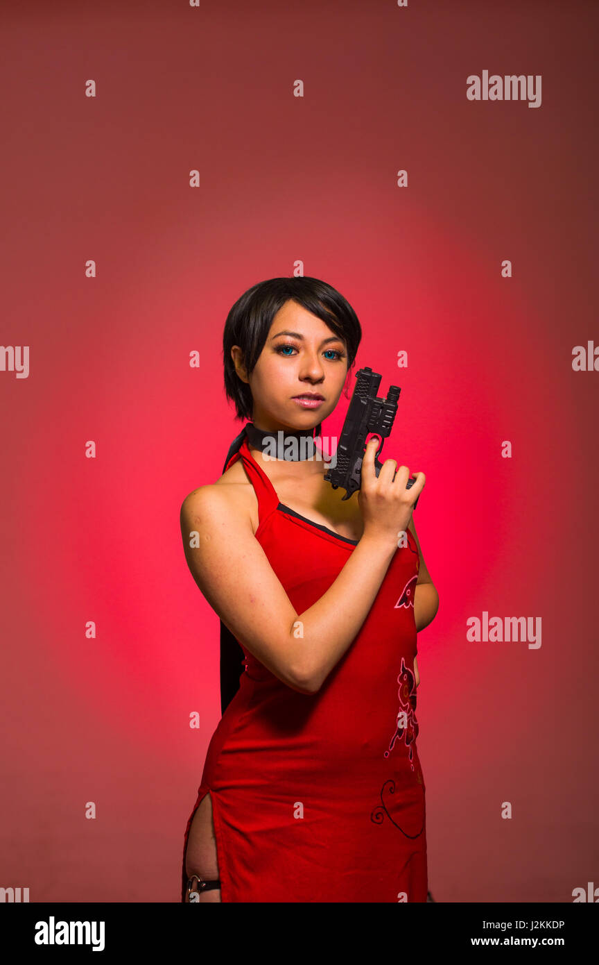 Powerful Woman with a gun, ada wong cosplay Stock Photo