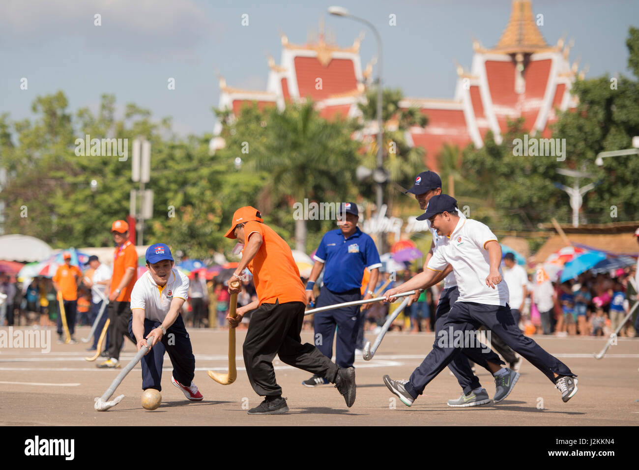 a Game of the traditional Hockey Tikhy or Lao Hockey at a ceremony at the Pha That Luang Festival in the city of vientiane in Laos in the southeastasi Stock Photo