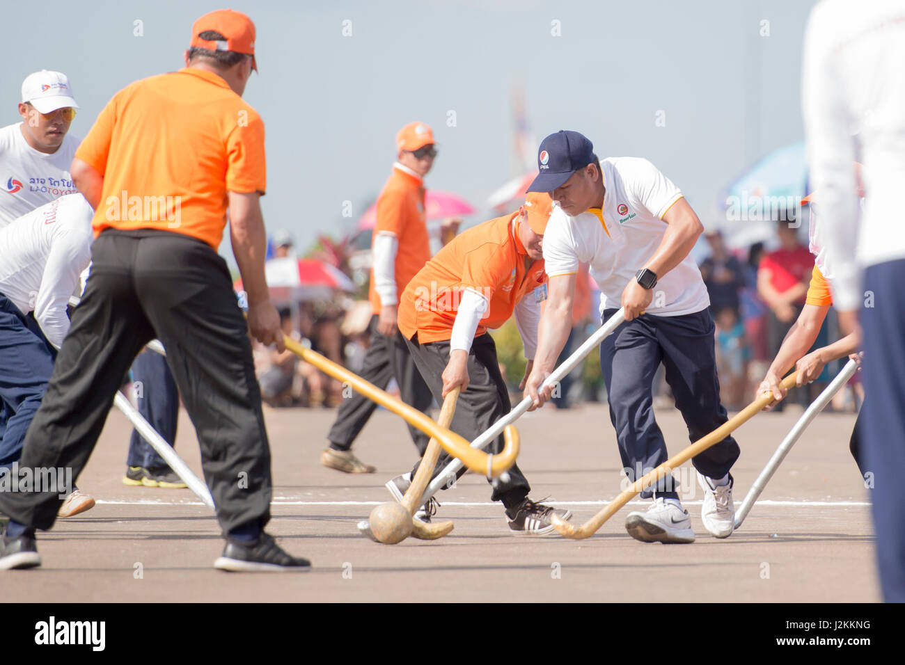 a Game of the traditional Hockey Tikhy or Lao Hockey at a ceremony at the  Pha That Luang Festival in the city of vientiane in Laos in the  southeastasi Stock Photo -