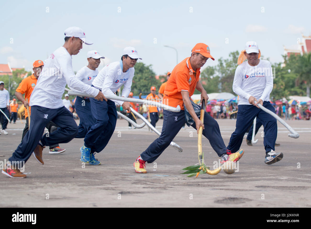 a Game of the traditional Hockey Tikhy or Lao Hockey at a ceremony at the Pha That Luang Festival in the city of vientiane in Laos in the southeastasi Stock Photo