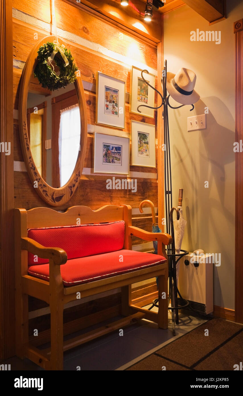 Wooden Sitting Bench With Red Cushions In Side Door Entrance
