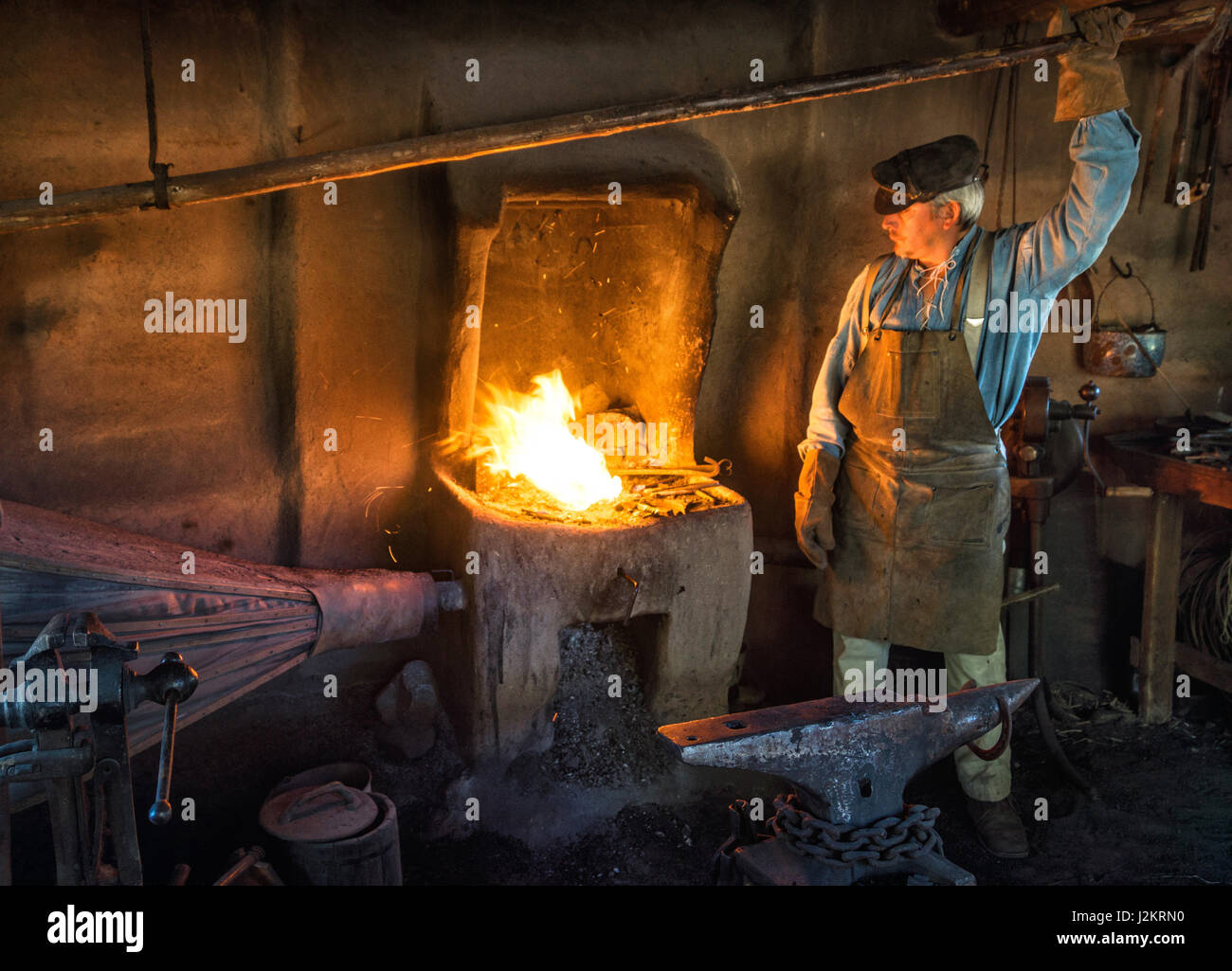 Blacksmith working  at Rancho de la Golondrinas.  A living history museum outside Santa Fe, New Mexico Stock Photo