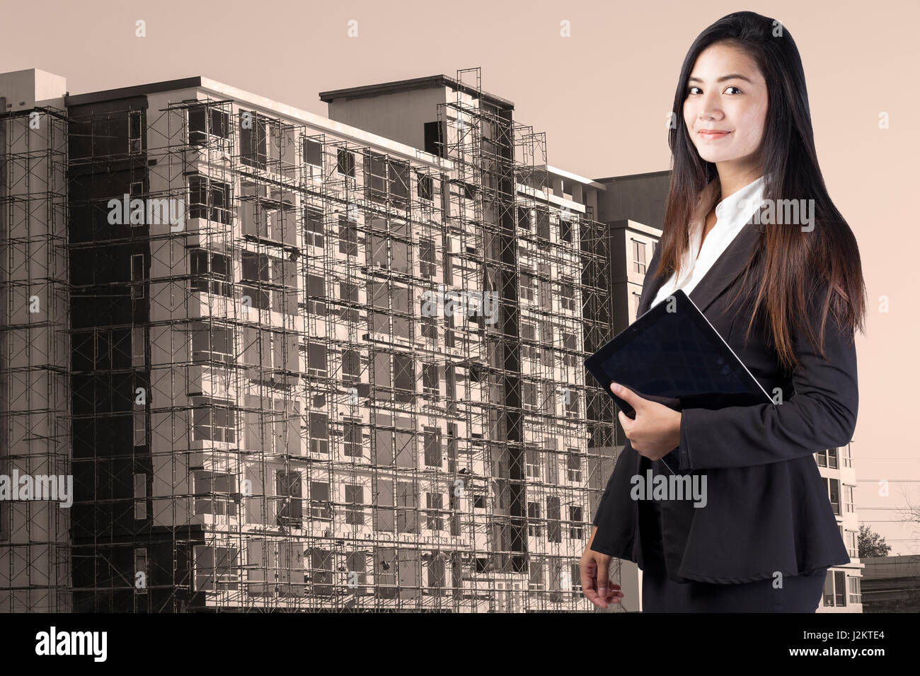 building, developing, construction and architecture concept - smiling woman Stock Photo