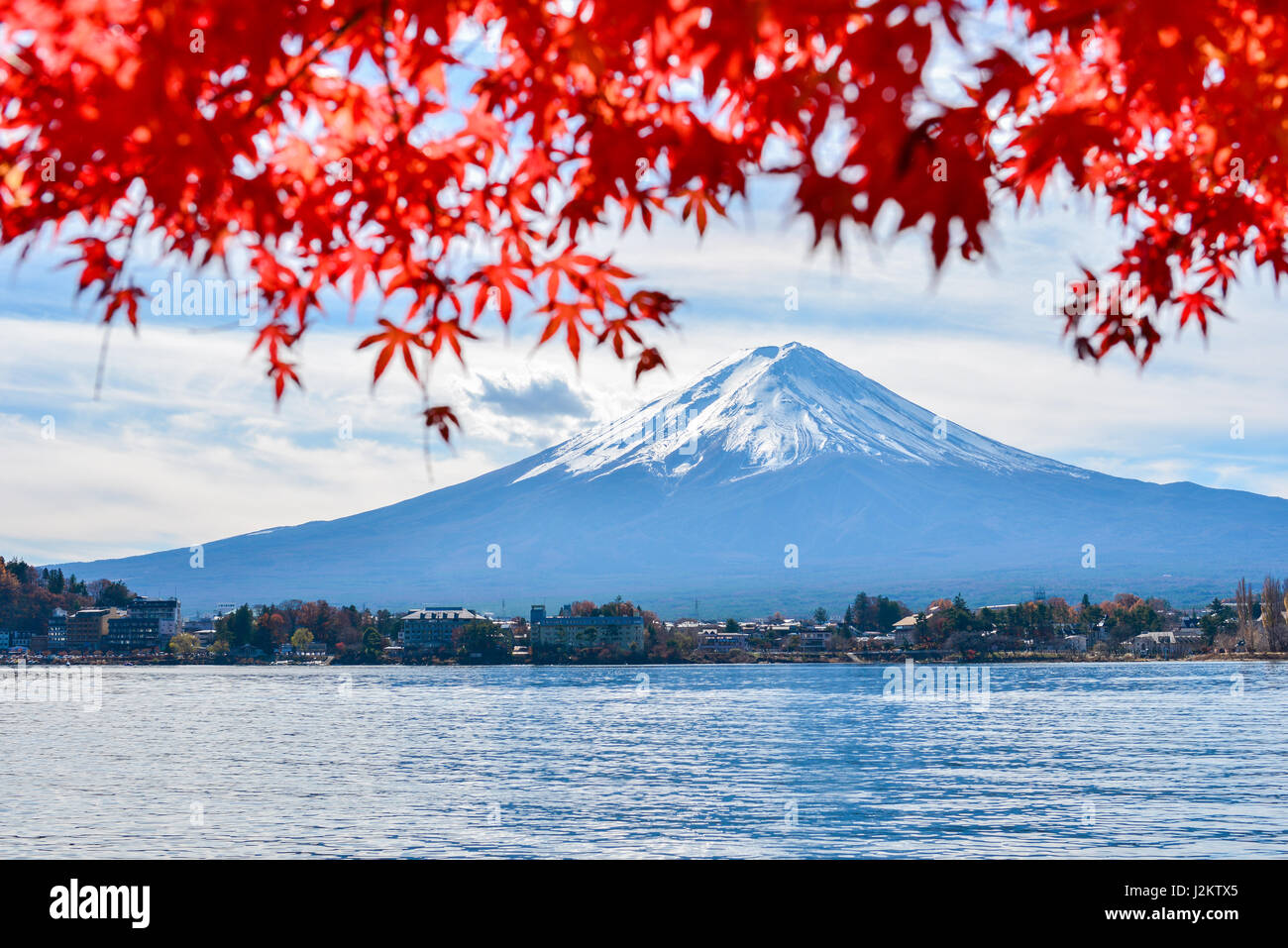 Mt Fuji in autumn view from lake Kawaguchiko. Red maple leaves in Fuji Stock Photo