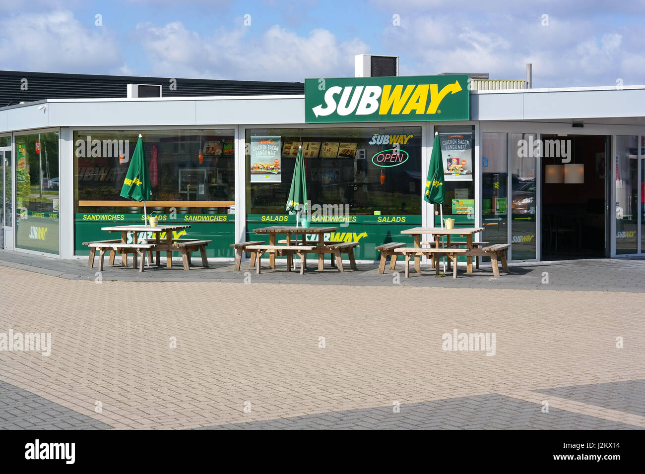 Unoccupied sidewalk cafe of a Subway Restaurant Stock Photo