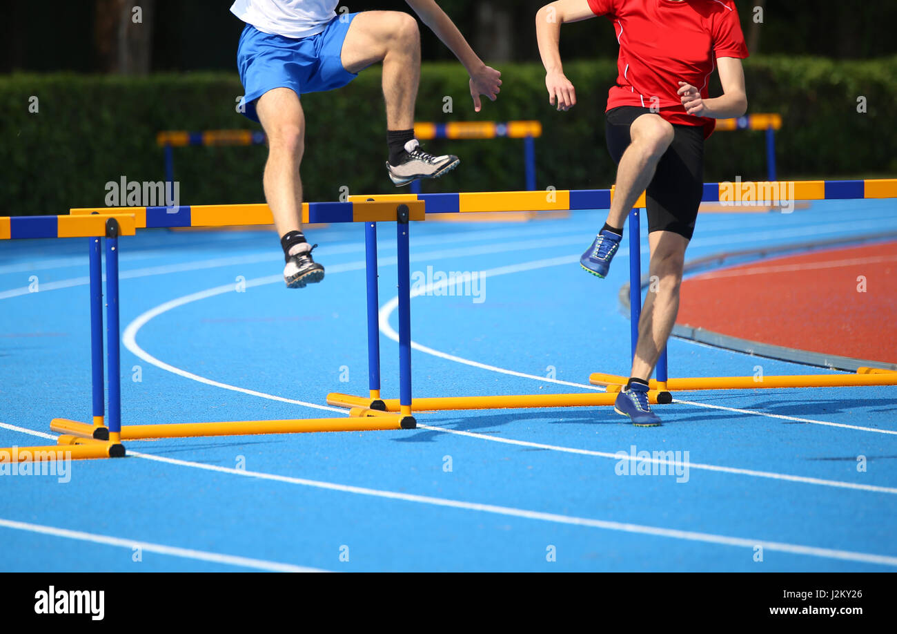 Boy running hurdles hires stock photography and images Alamy