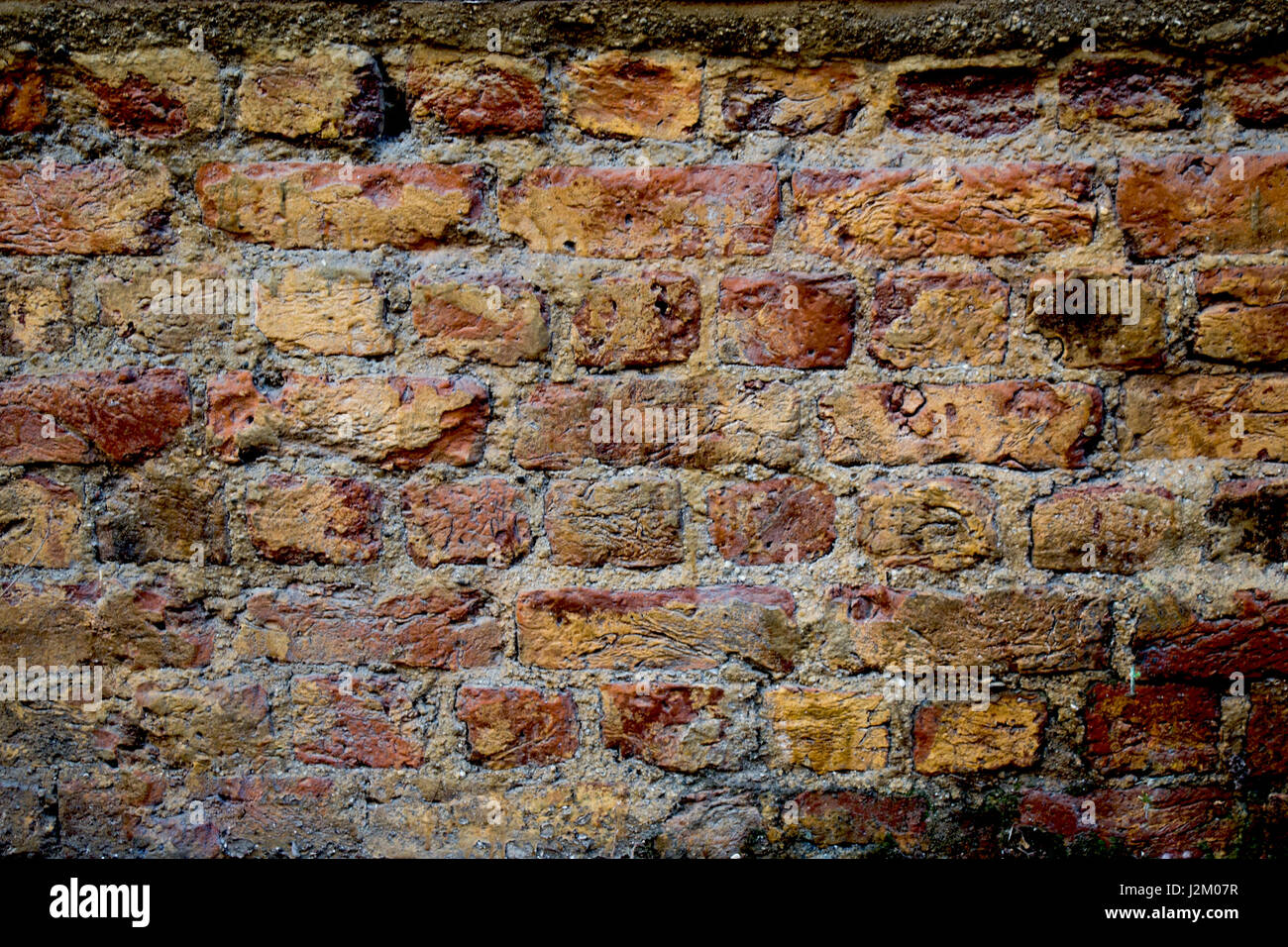 Old grunge brick wall as a background Stock Photo - Alamy