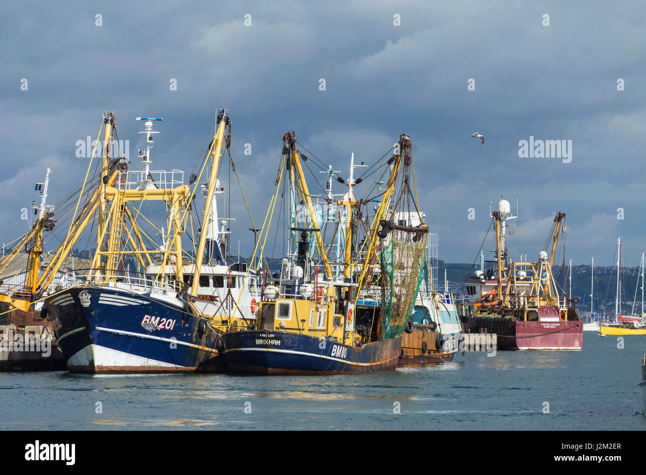 Fishing boats moored in Brixham Harbour, Devon, UK Stock Photo