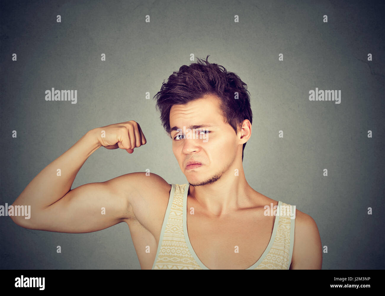 Funny sport man flexing his biceps Stock Photo