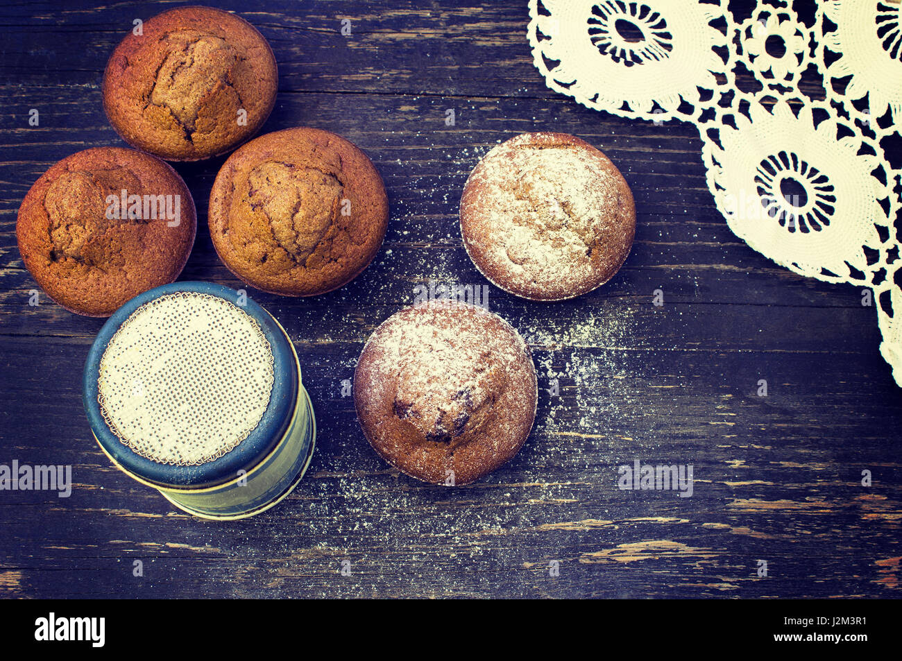 Close up of chocolate muffins on wooden table.Toning effect Stock Photo