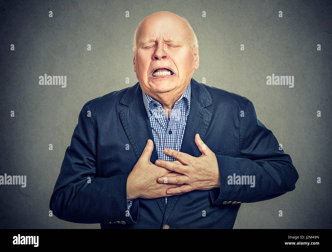 Senior man with heart attack Stock Photo