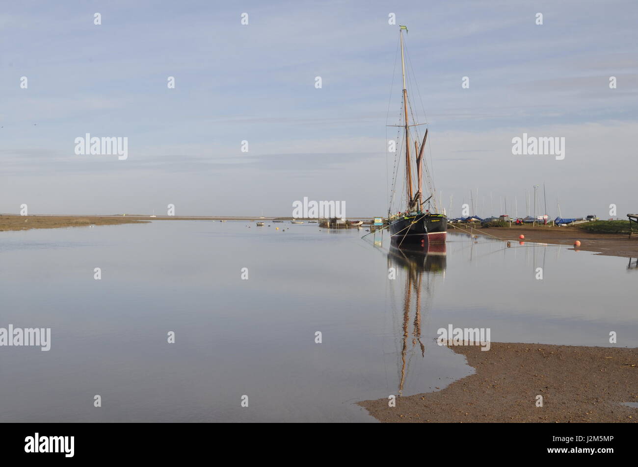 Blakeney creek north Norfolk, UK, with the sailing barge Juno. Stock Photo
