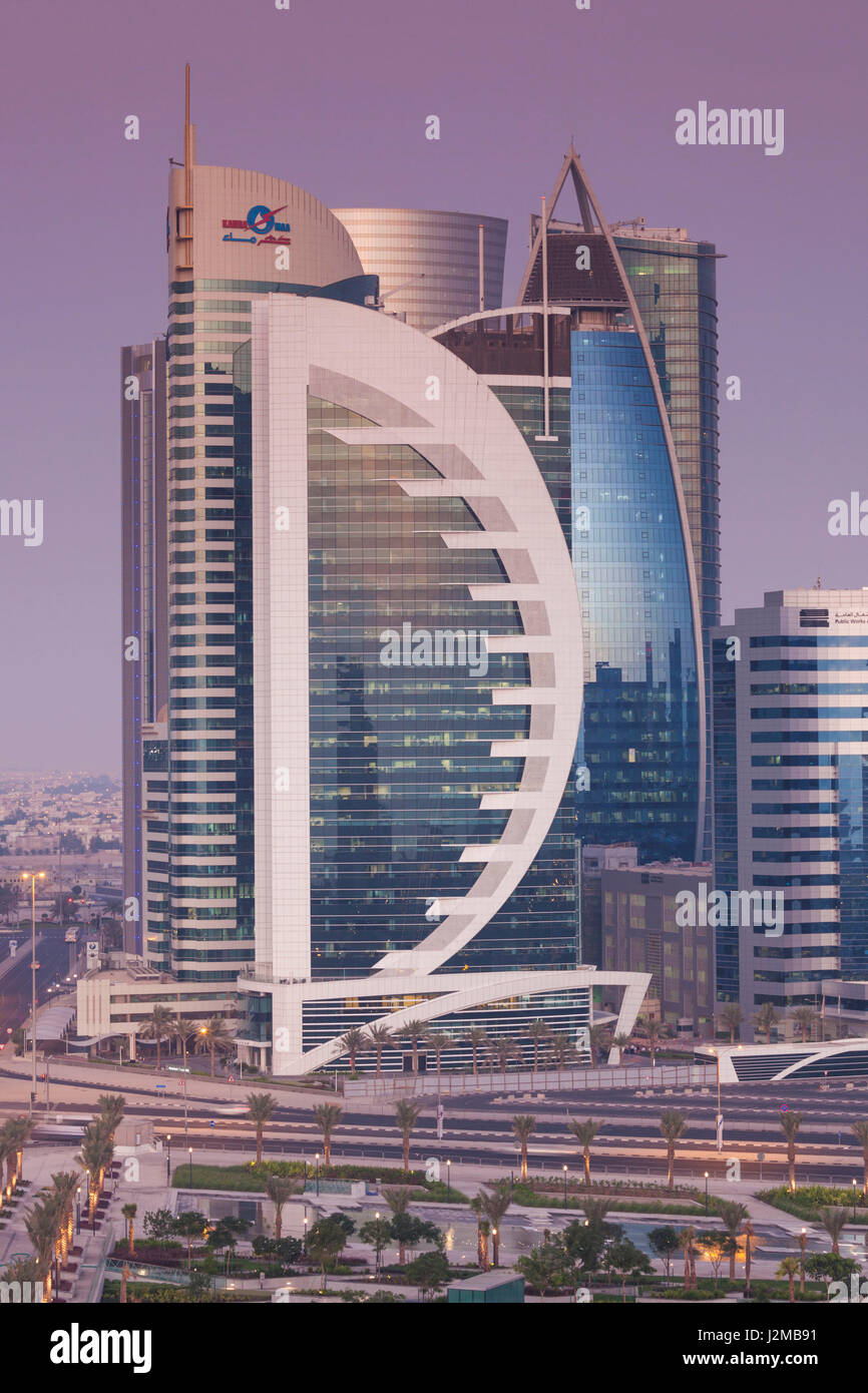 Qatar, Doha, Doha Bay, West Bay skyscrapers, Doha Bank Tower, dusk