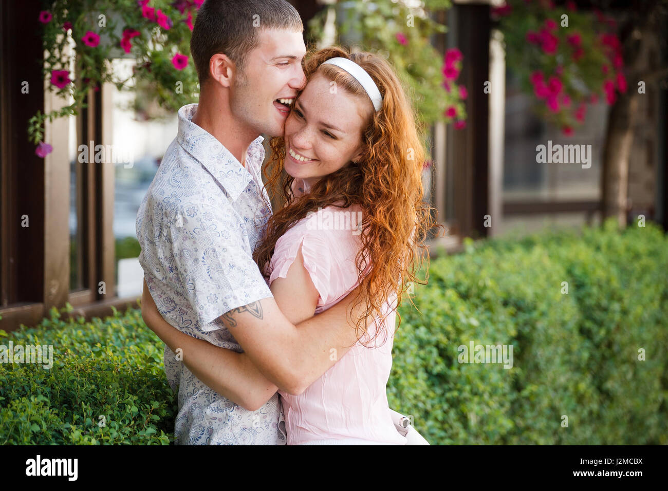 Candid couple hugging hi-res stock photography and images - Alamy