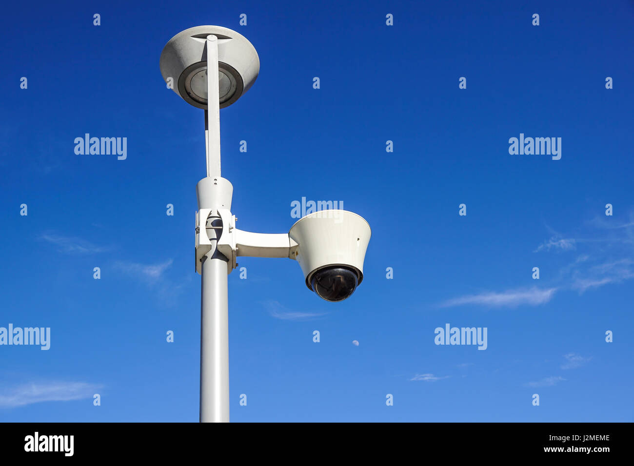security cctv cameras on a pole with blue sky background Stock Photo