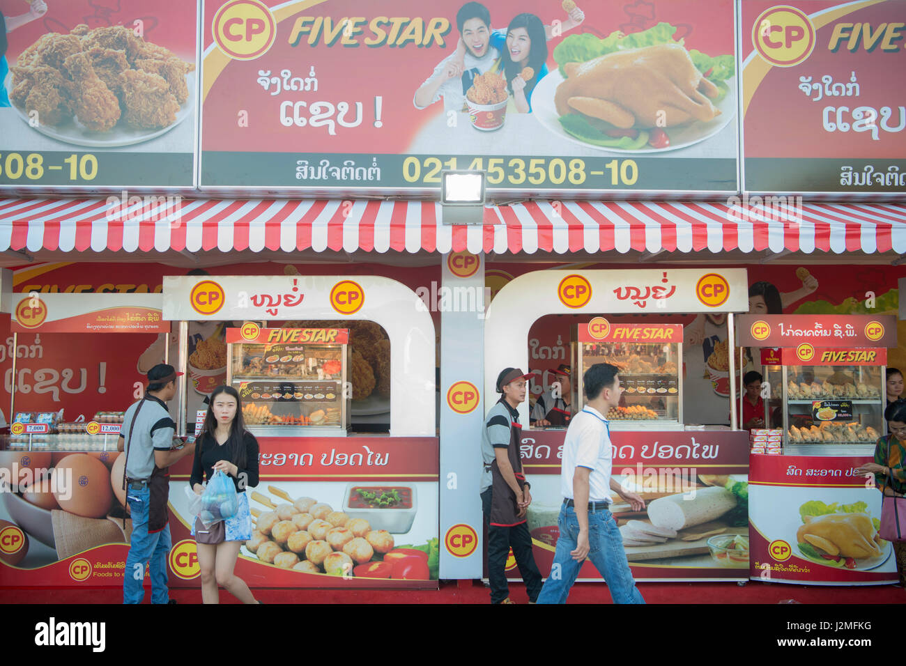 a chicken take away shop at the market at the Pha That Luang Festival in the city of vientiane in Laos in the southeastasia. Stock Photo