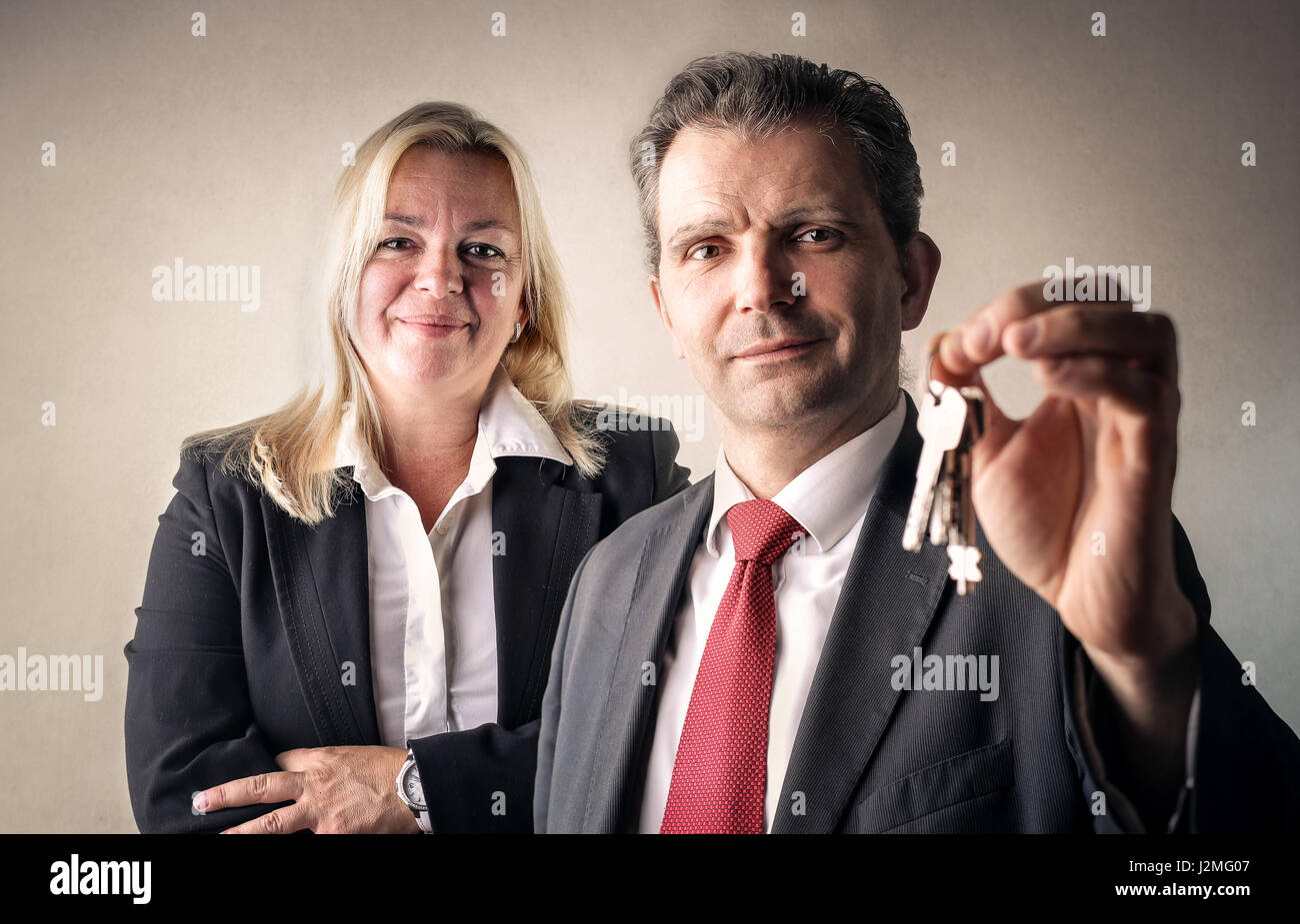 Business woman and man with key Stock Photo
