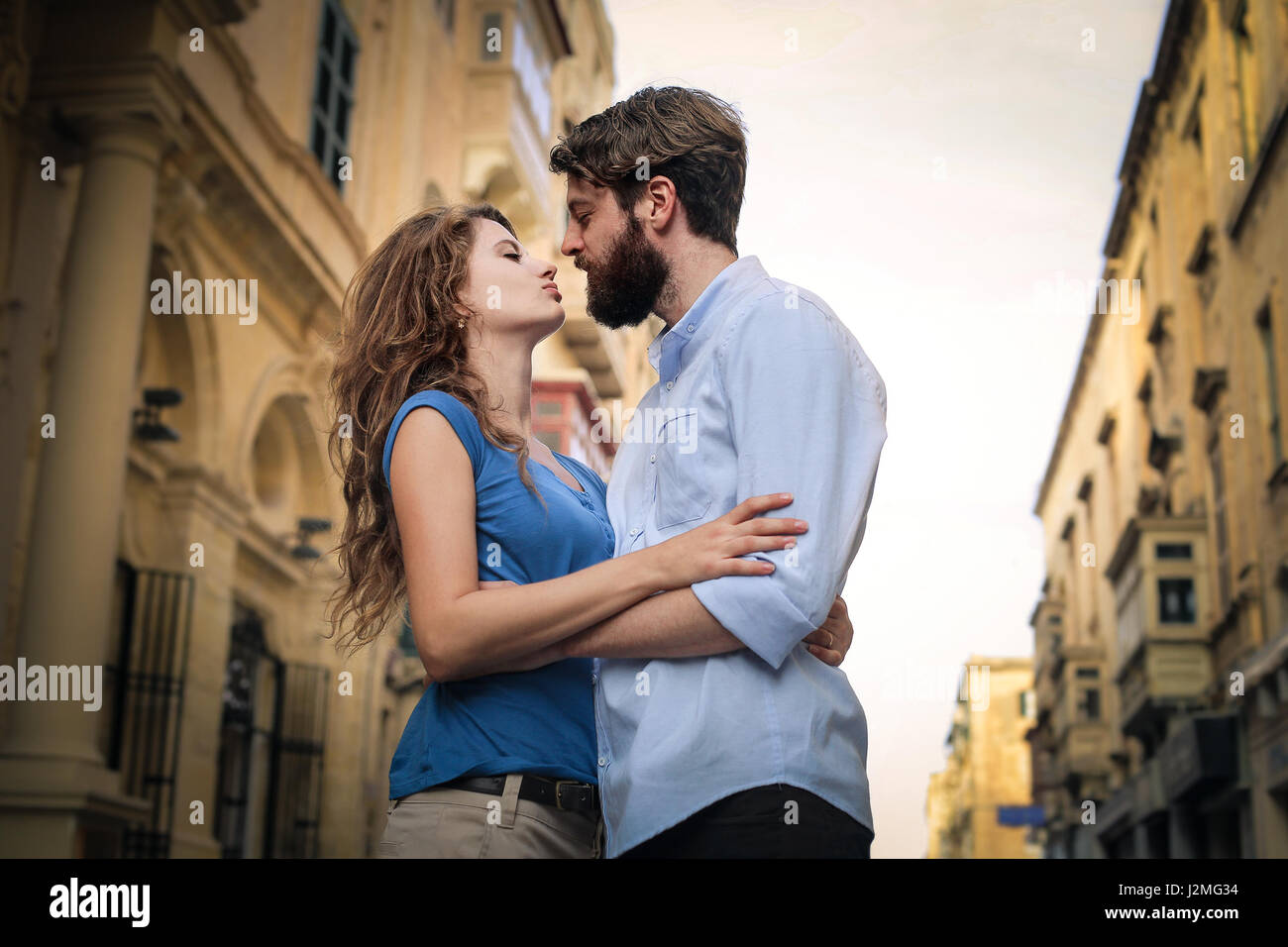 Couple almost kissing outside Stock Photo