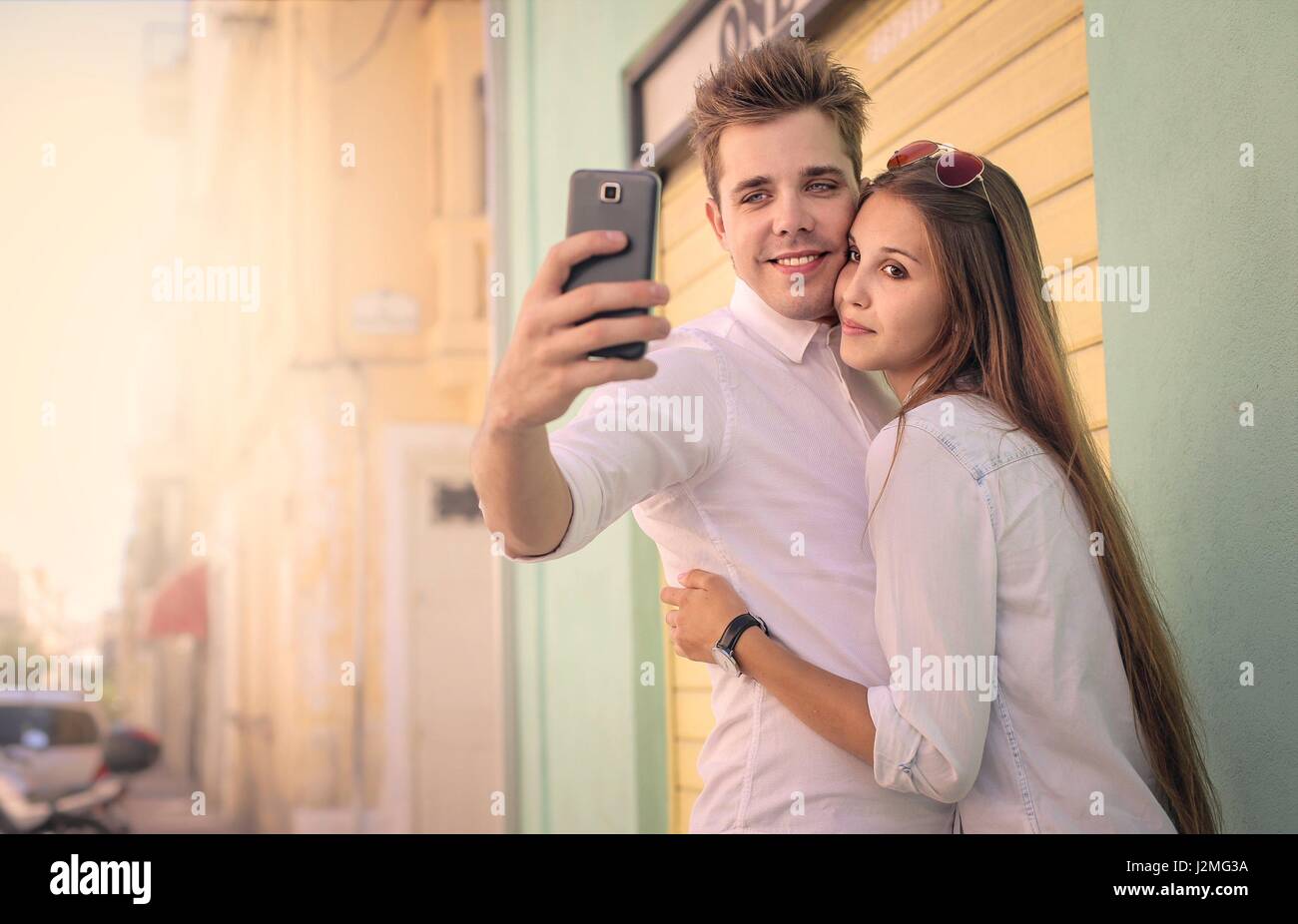 Young couple taking a selfie Stock Photo - Alamy