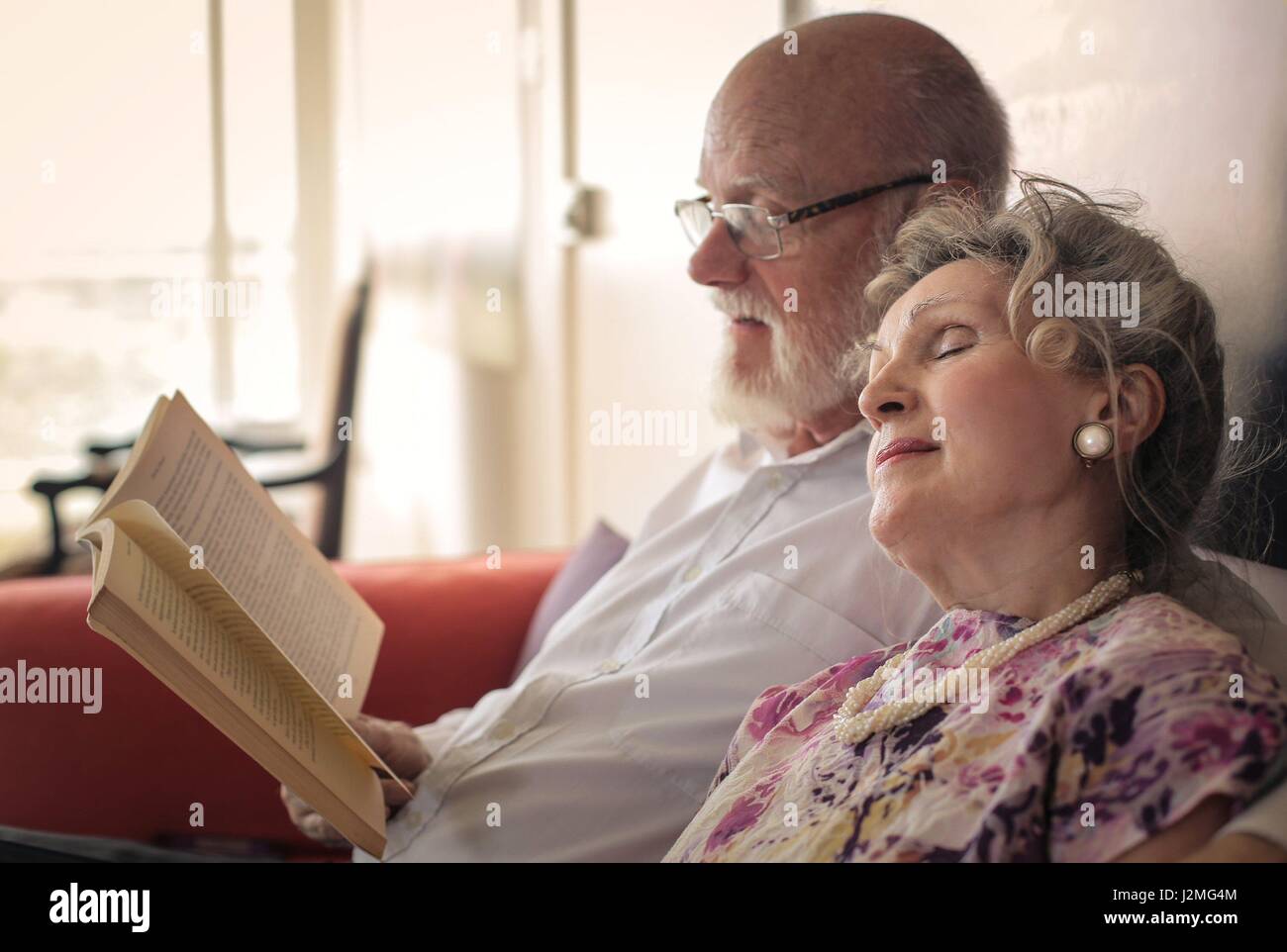 Old couple resting together Stock Photo