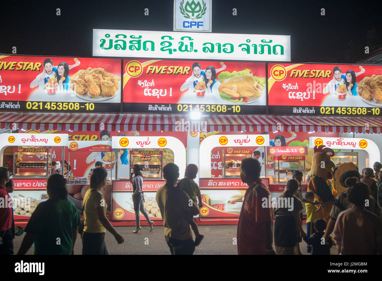 a chicken take away shop at the market at the Pha That Luang Festival in the city of vientiane in Laos in the southeastasia. Stock Photo