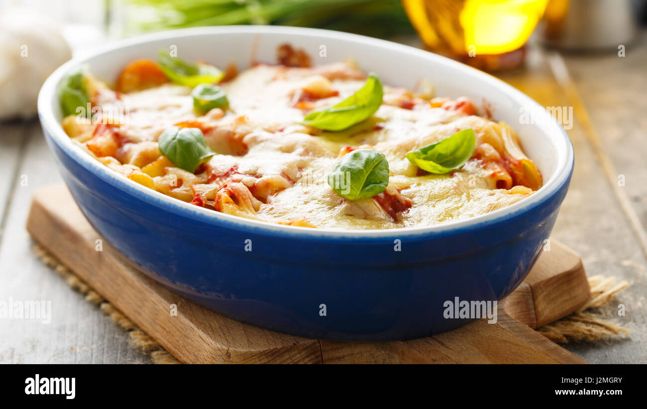 Fresh meatless italian pasta bake with vegetables and basil. Stock Photo