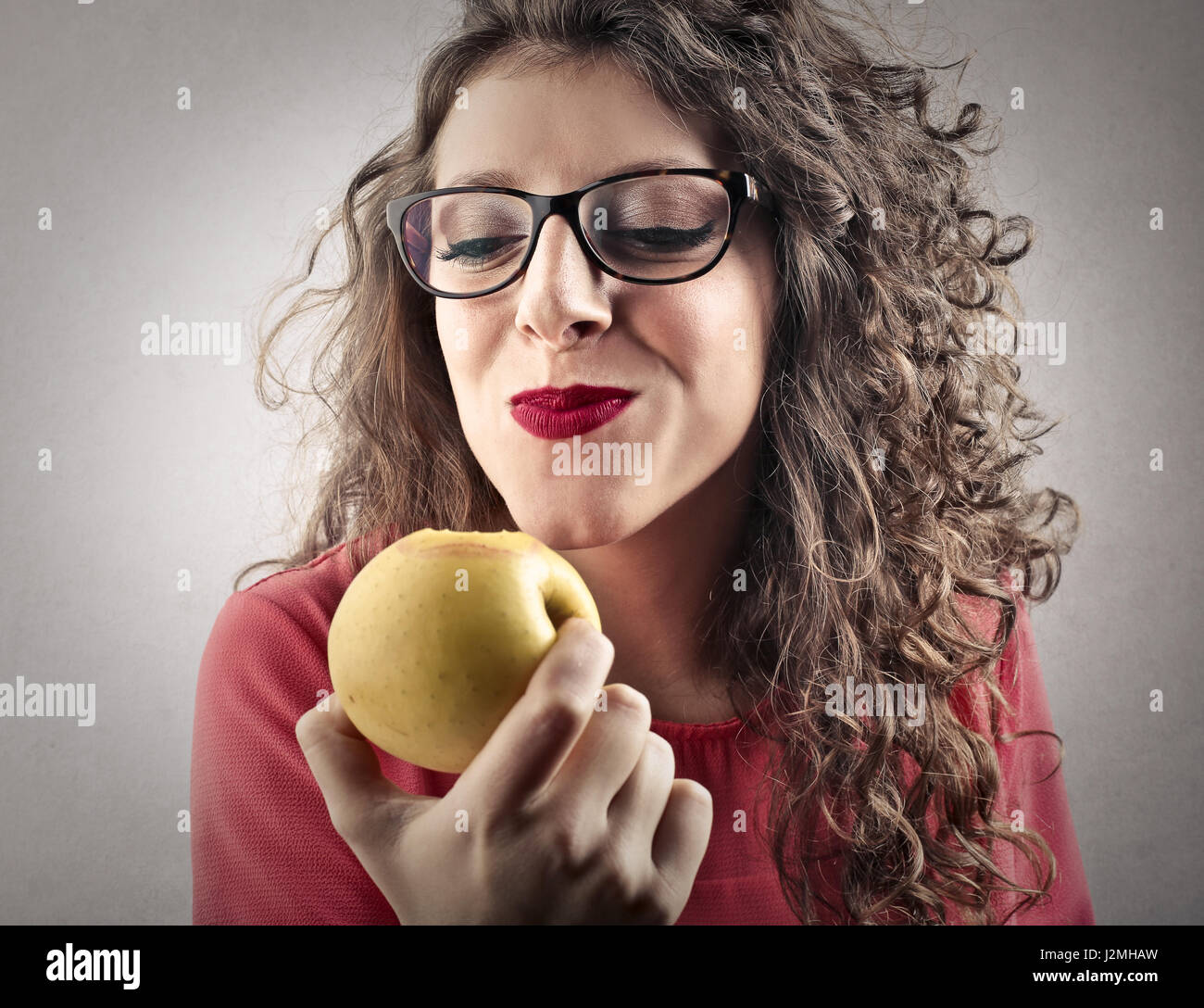 Pretty woman eating apple Stock Photo