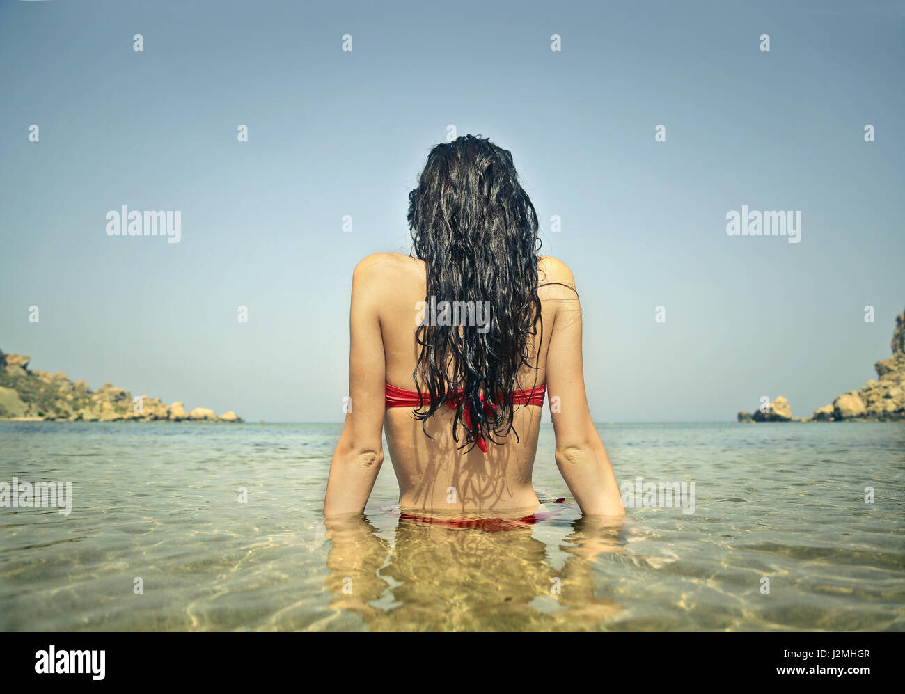 Young woman in the sea Stock Photo