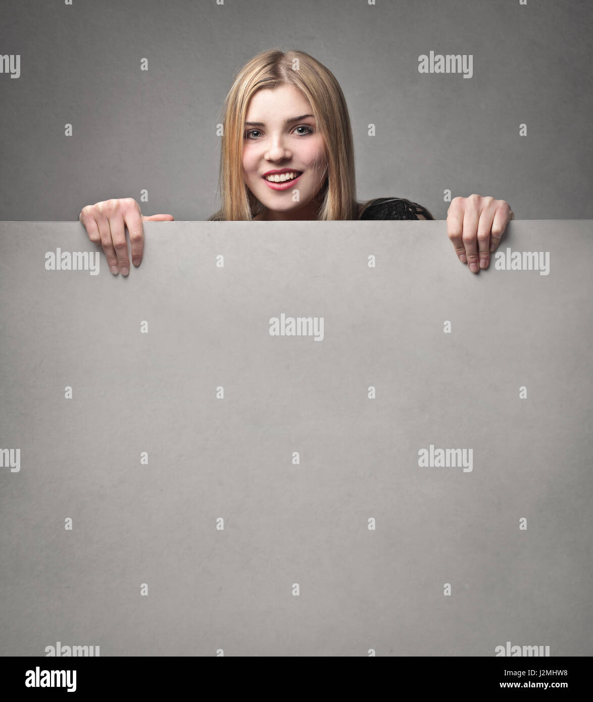 Woman holding white paper Stock Photo