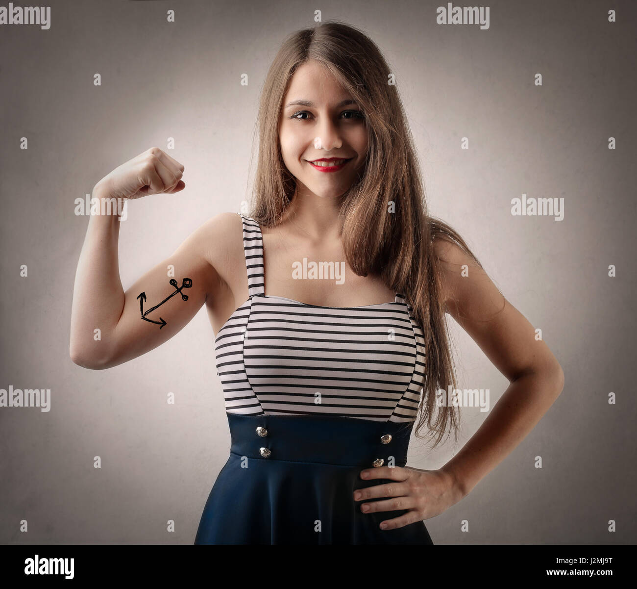 Strong woman with tattoo Stock Photo - Alamy