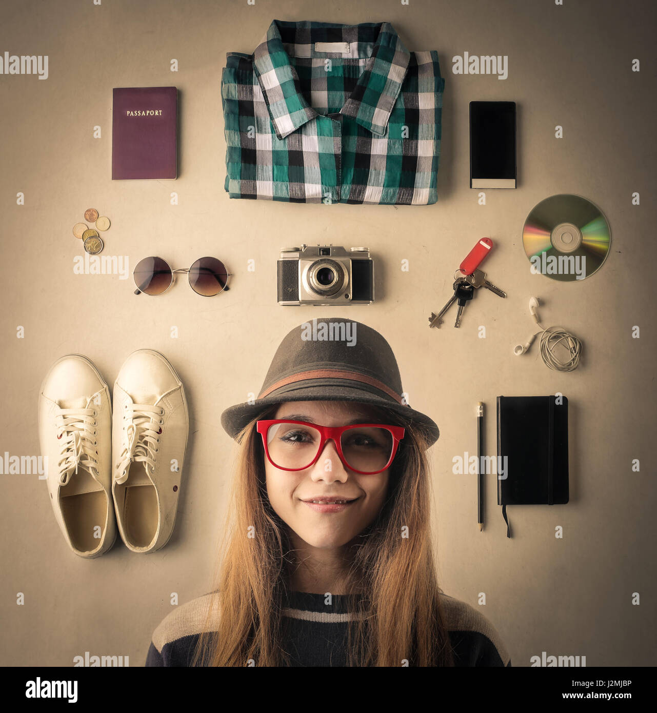 Woman with travel stuff next to her Stock Photo