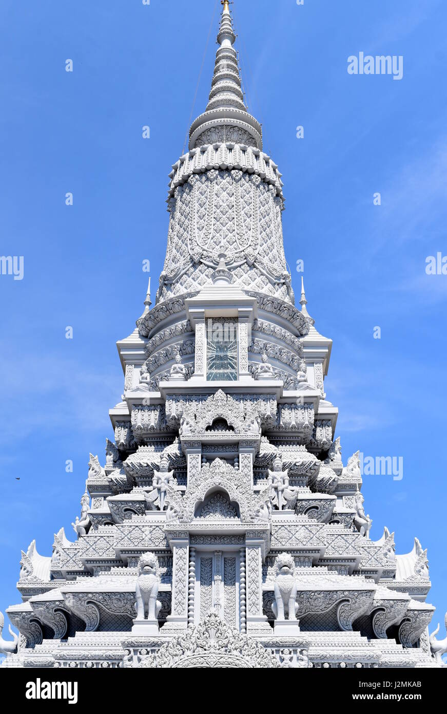 White Buddhist stupa against blue sky, Oudong, Cambodia Stock Photo
