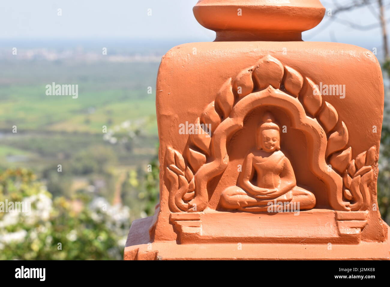 Meditating Buddha decoration detail outdoors at Phnom Oudong stupa and Buddhist temple, Cambodia