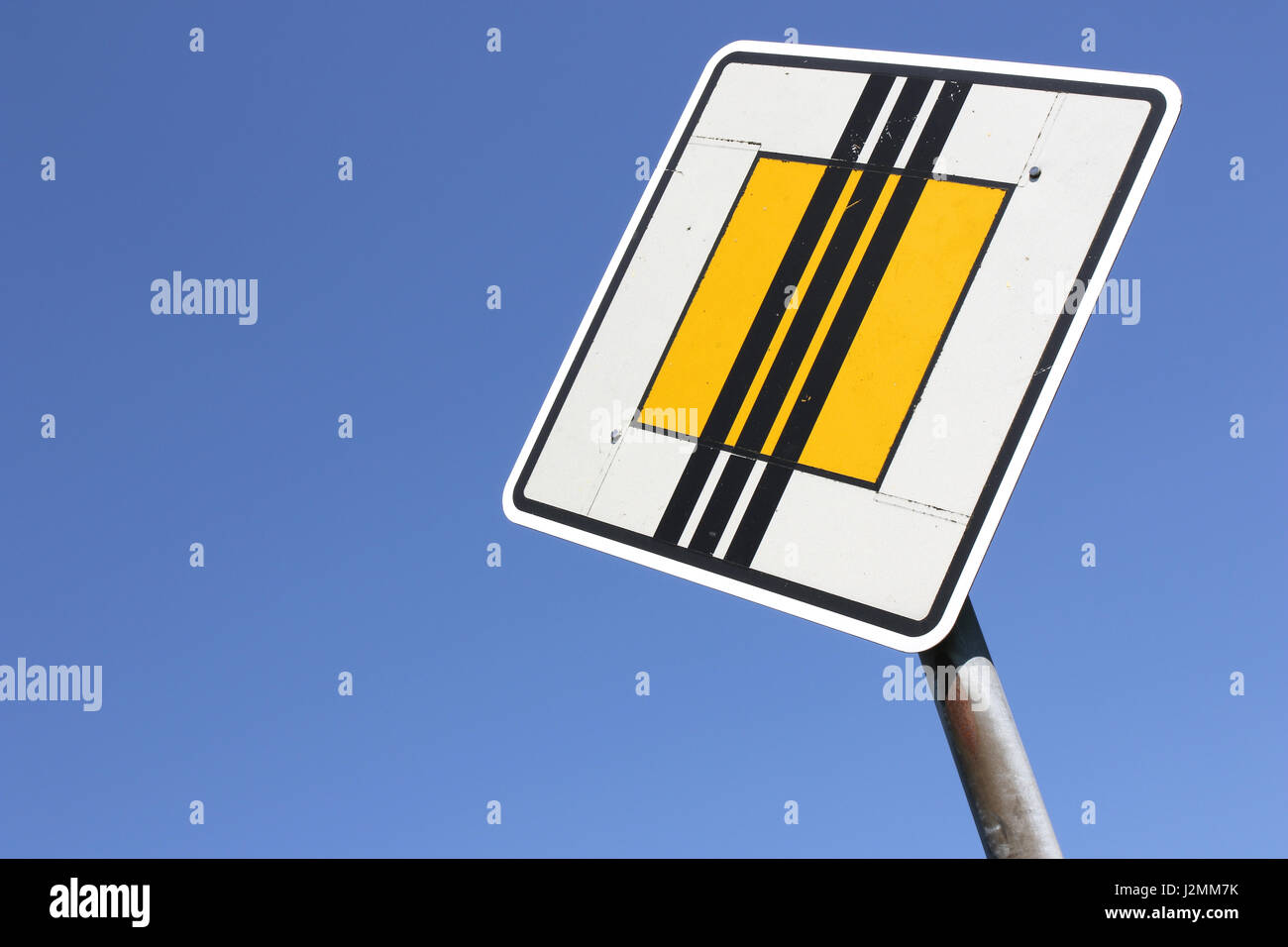 German road sign: end of priority road Stock Photo