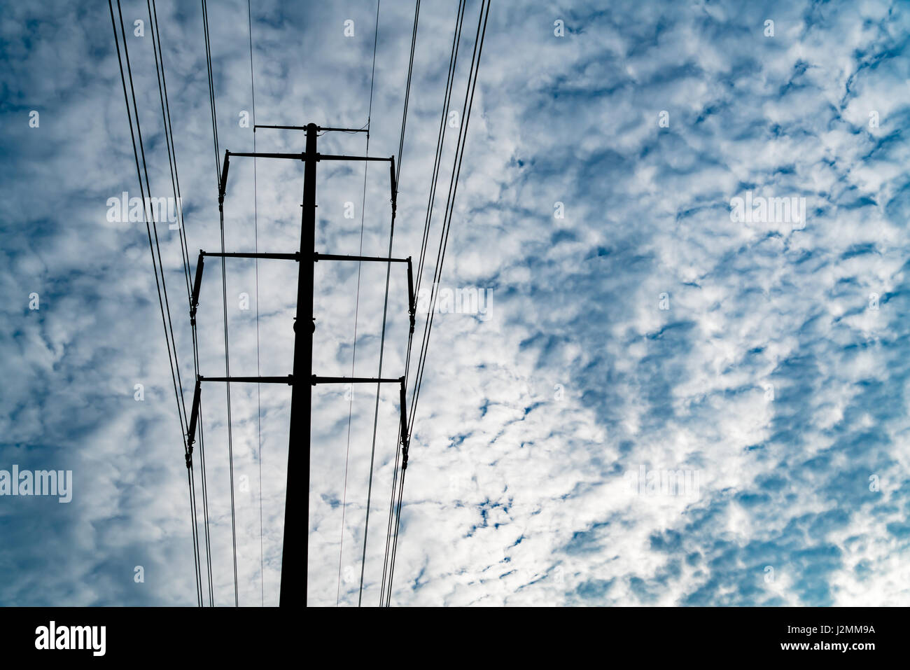 high voltage electric power supply pole on the cloudy sky background ...