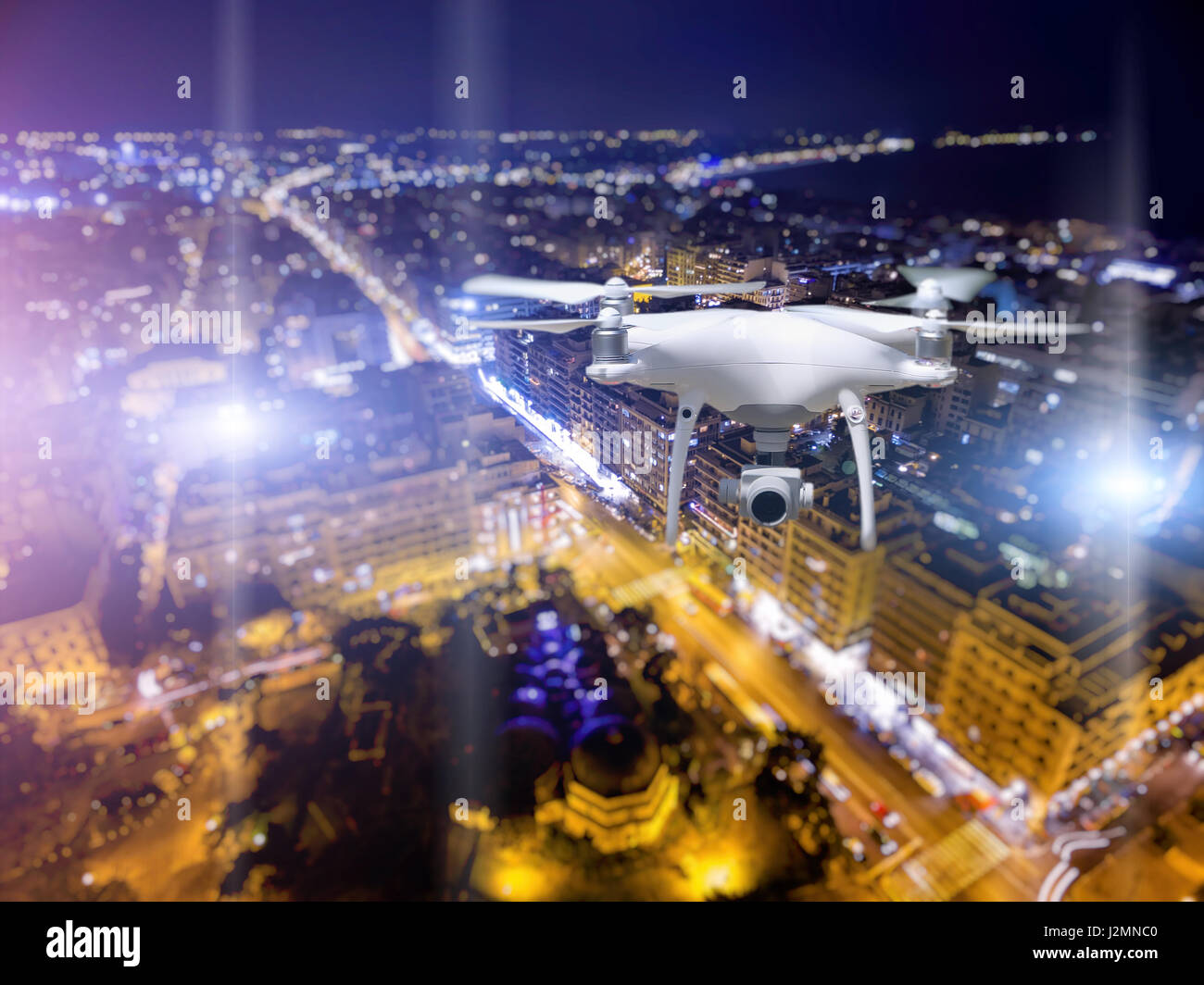 Drone flying over Thessaloniki city on blurred background. Stock Photo