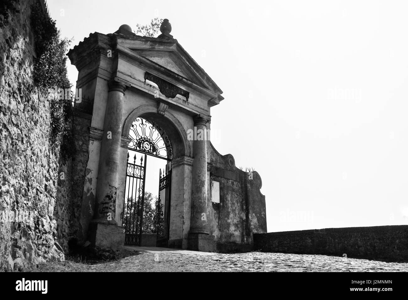 Monselice, Italy, 21 Apr 2017 - black and white picture of an Imposing opened iron gate located in Monselice Stock Photo