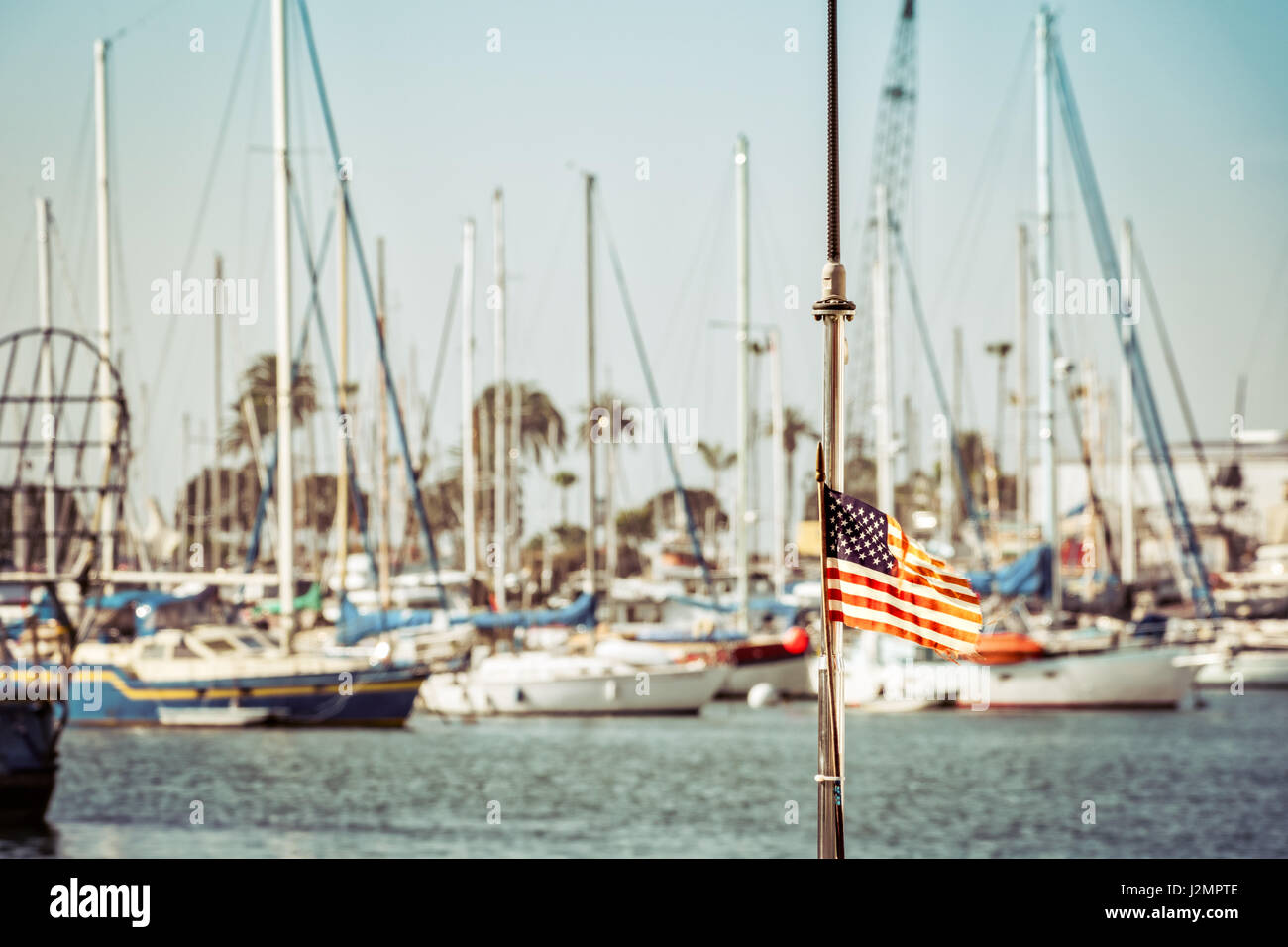 A flag on the back of a boat in a southern California marina. Stock Photo