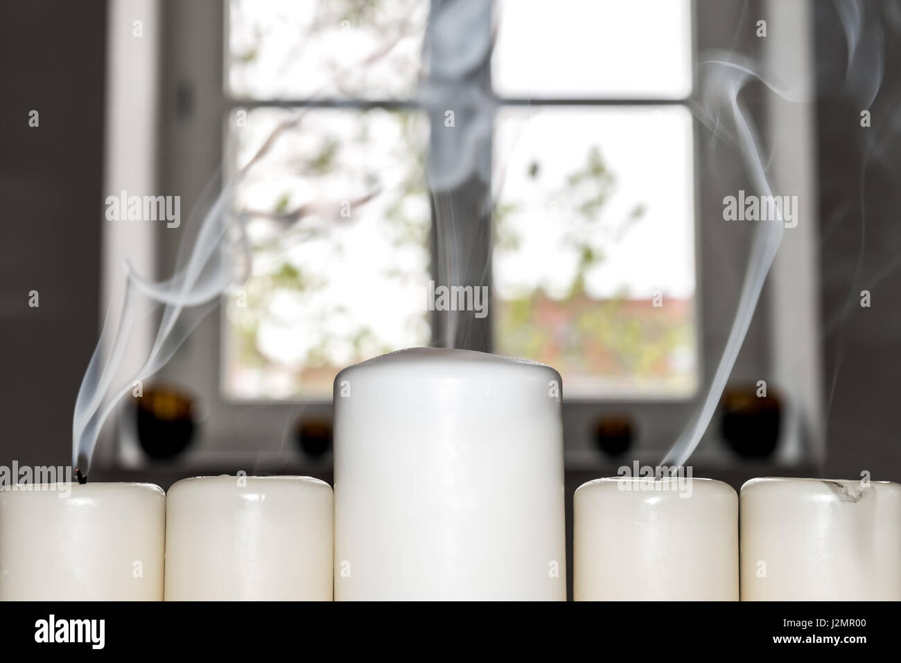Closeup of white blown out candles with smoke Stock Photo Alamy