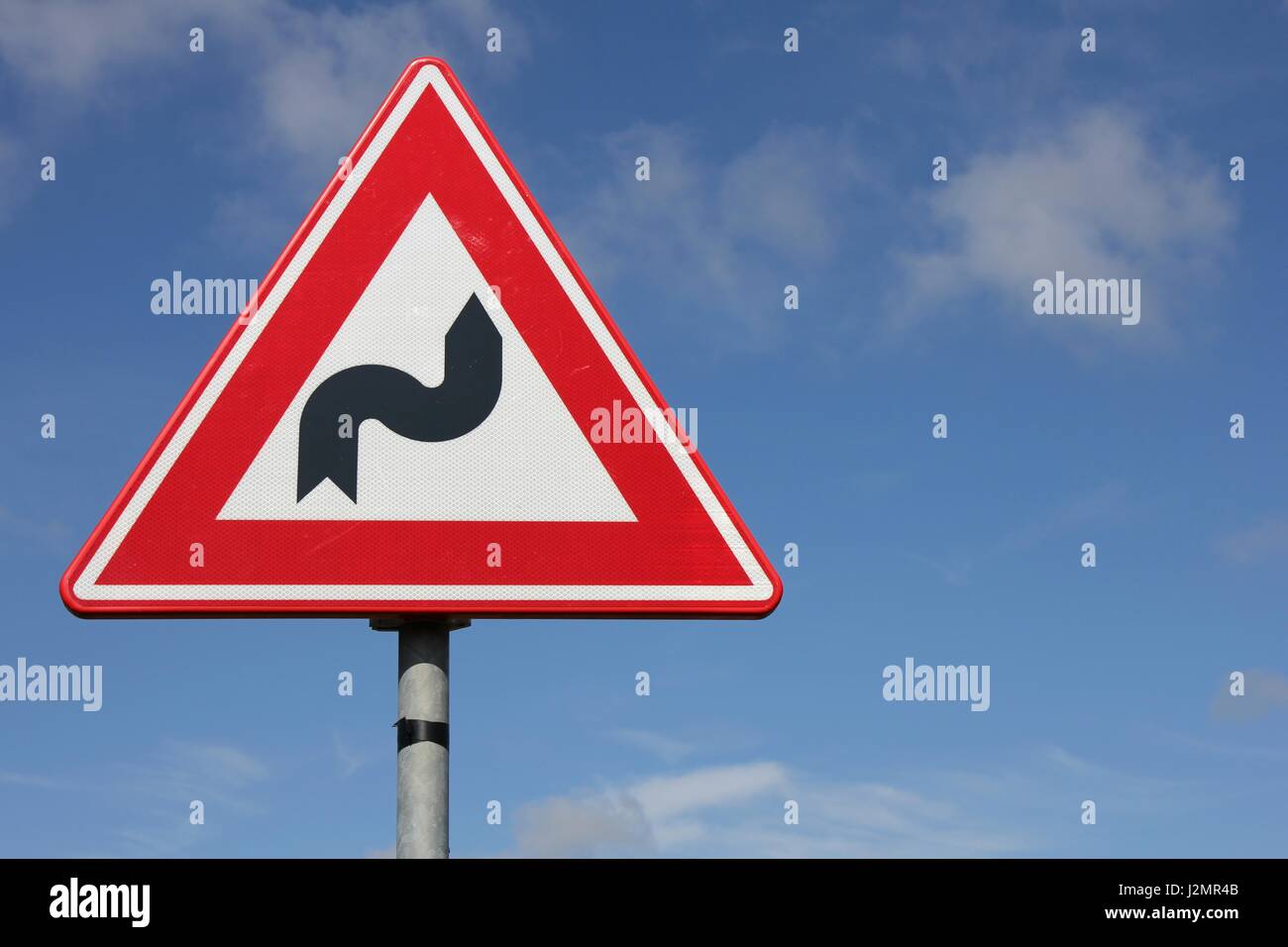 Double curve road traffic sign hi-res stock photography and images - Alamy