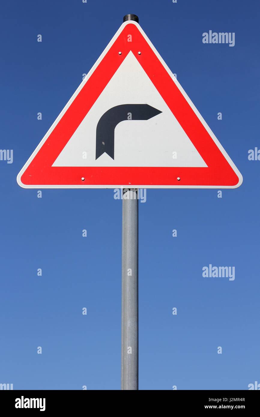 German road sign: dangerous curve Stock Photo